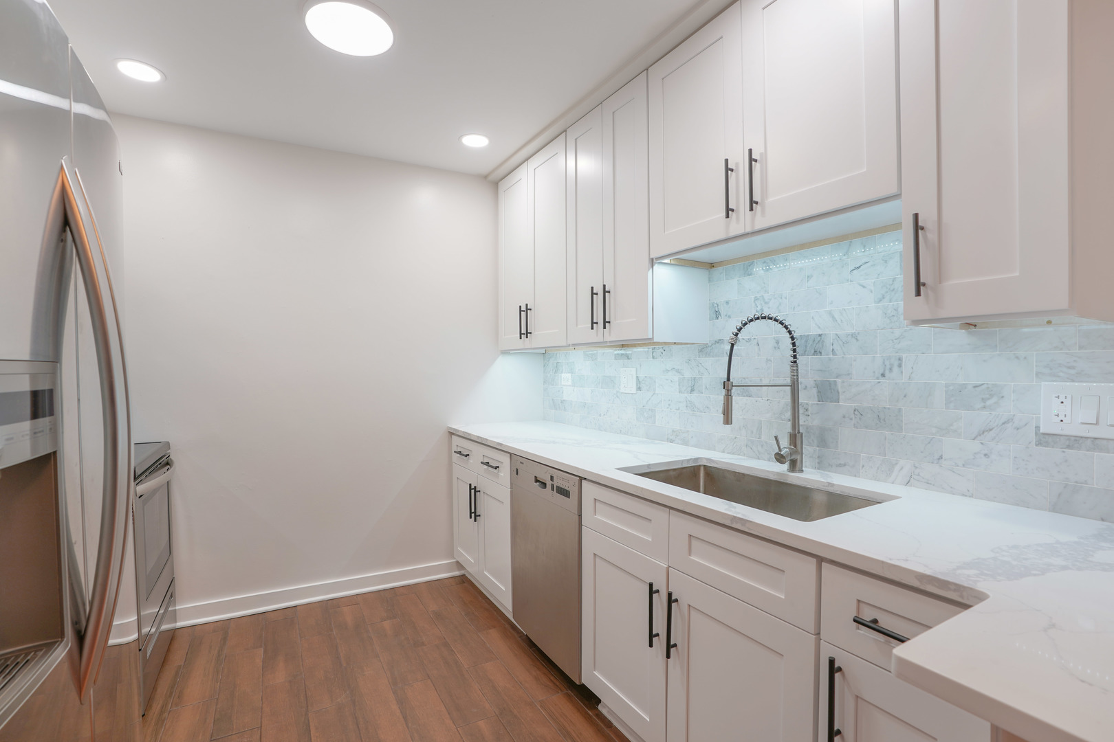 816 East Old Willow Road, Unit 112 Prospect Heights, IL 60070 - Photo 7 of 17 a kitchen with a sink cabinets and appliances