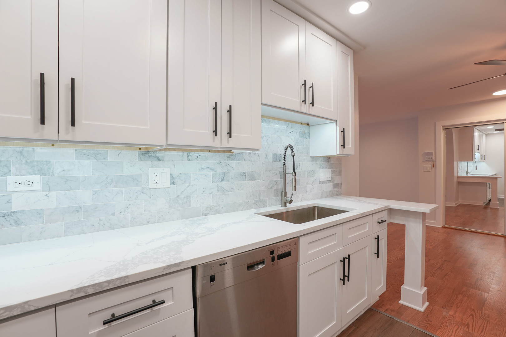 816 East Old Willow Road, Unit 112 Prospect Heights, IL 60070 - Photo 9 of 17 a kitchen with stainless steel appliances granite countertop a sink a stove and cabinets