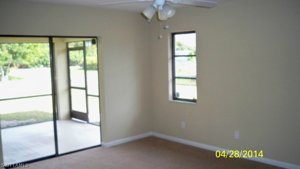 17513 Fuchsia Road Fort Myers, FL 33967 - Photo 11 of 12 a view of an empty room with a window