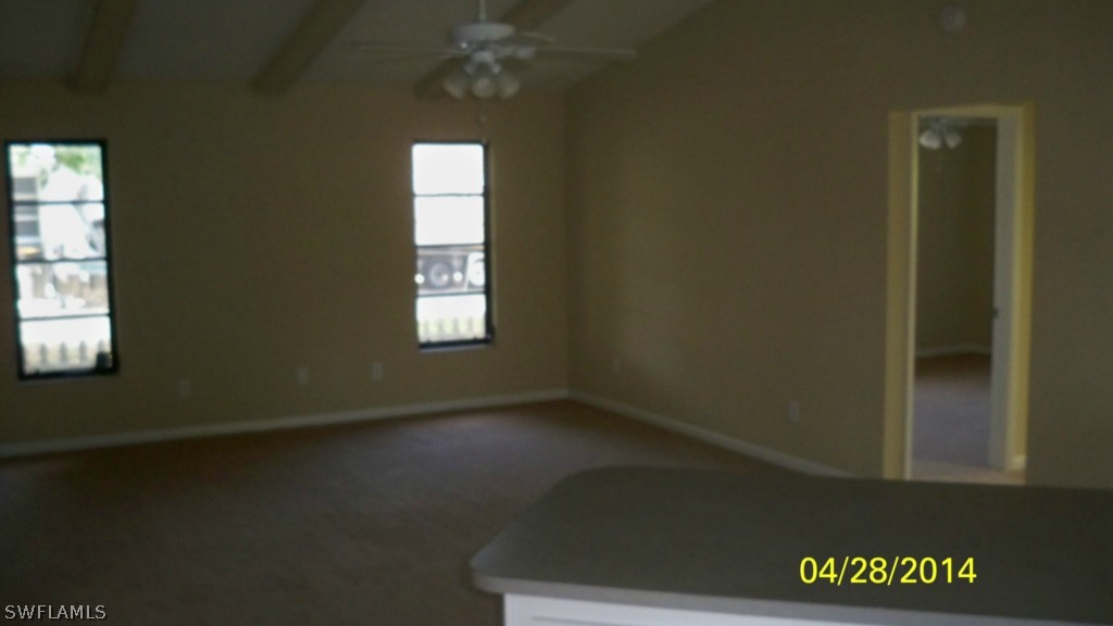 17513 Fuchsia Road Fort Myers, FL 33967 - Photo 6 of 12 an empty room with a window