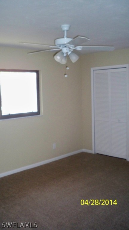 17513 Fuchsia Road Fort Myers, FL 33967 - Photo 8 of 12 an empty room with a window