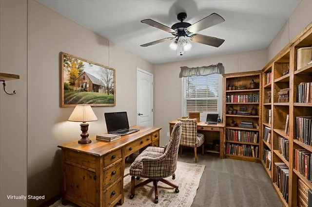 a workspace with furniture and window
