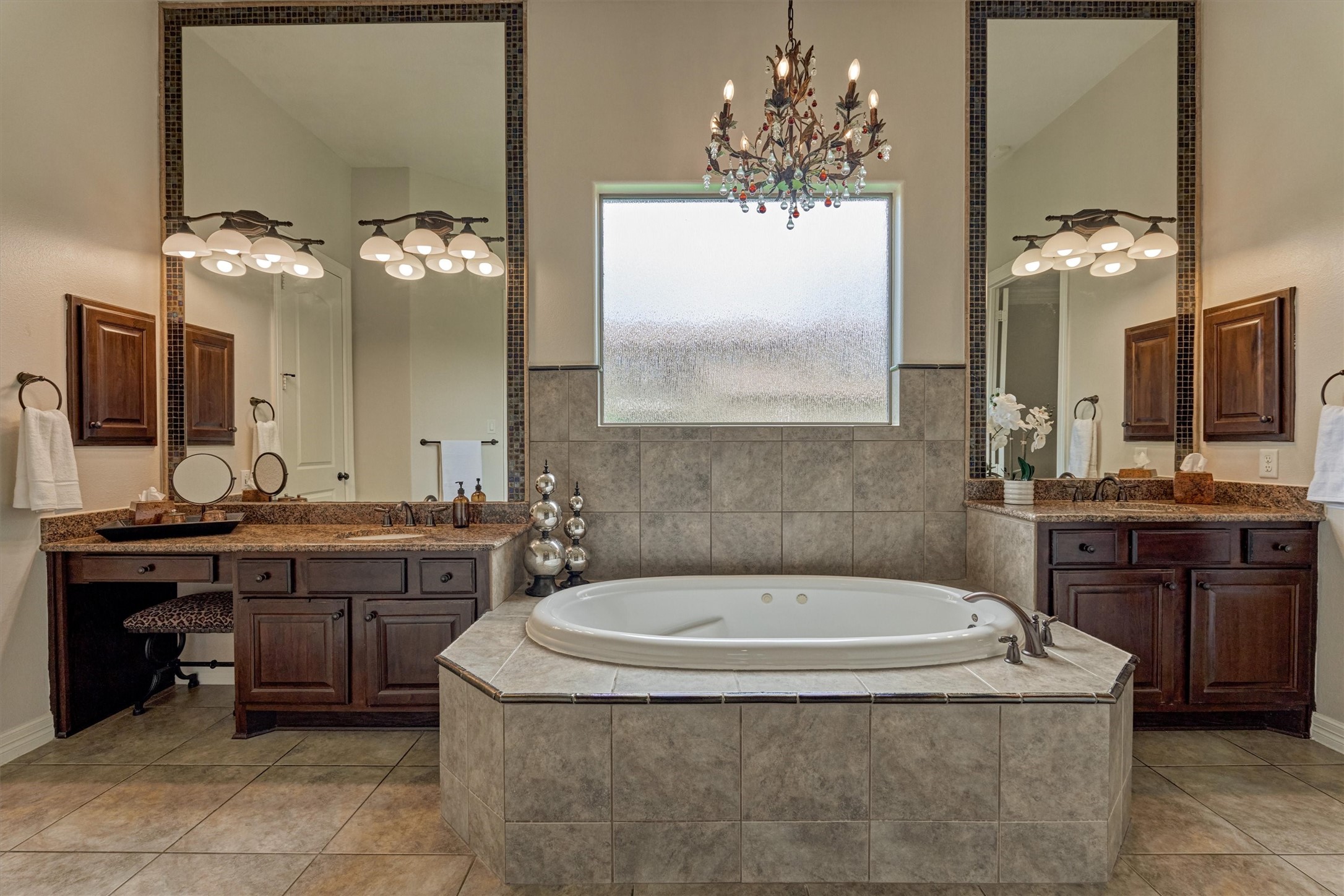 67 South Sage Sparrow Circle Spring, TX 77389 - Photo 19 of 49 a bathroom with a tub a sink and a large mirror