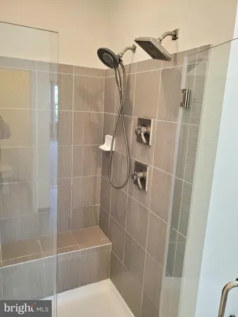 a bathroom with a shower and a sink
