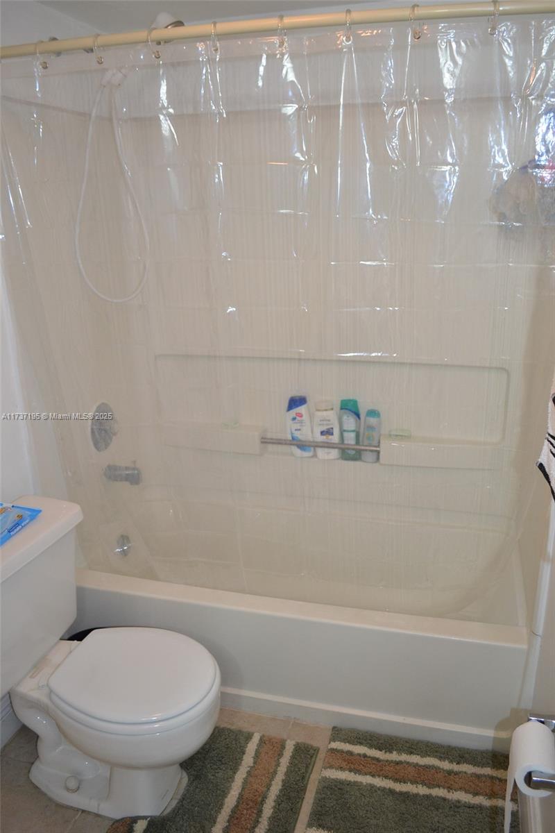 15201 Southwest 80th Street, Unit 207 Miami, FL 33193 - Photo 16 of 23 a bathroom with a toilet and a bathtub