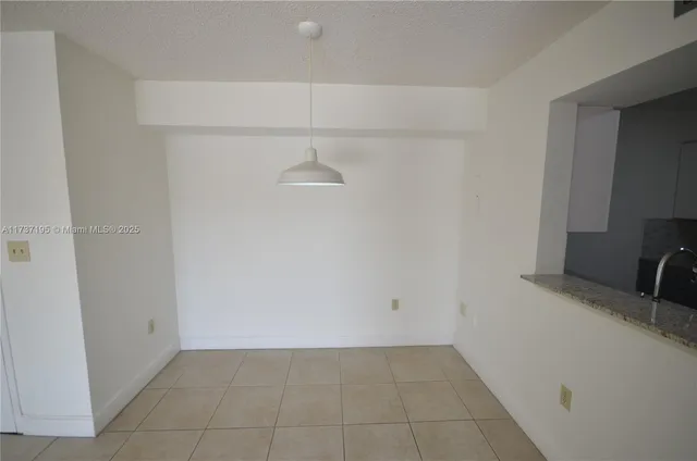 a view of storage and utility room with closet