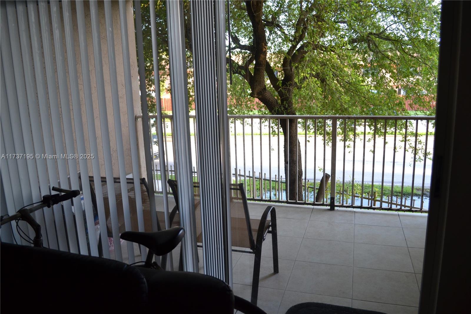 15201 Southwest 80th Street, Unit 207 Miami, FL 33193 - Photo 9 of 23 a view of balcony and wooden floor