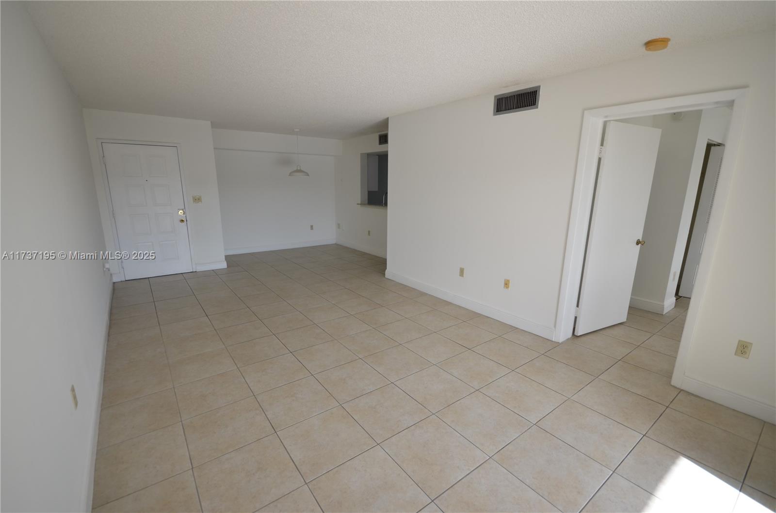 15201 Southwest 80th Street, Unit 207 Miami, FL 33193 - Photo 10 of 23 an empty room with white walls
