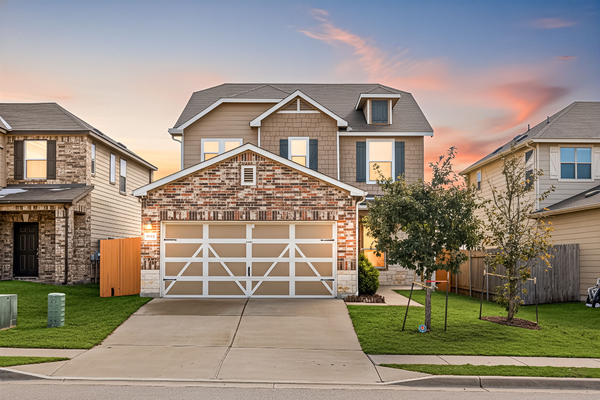 a front view of a house with a yard