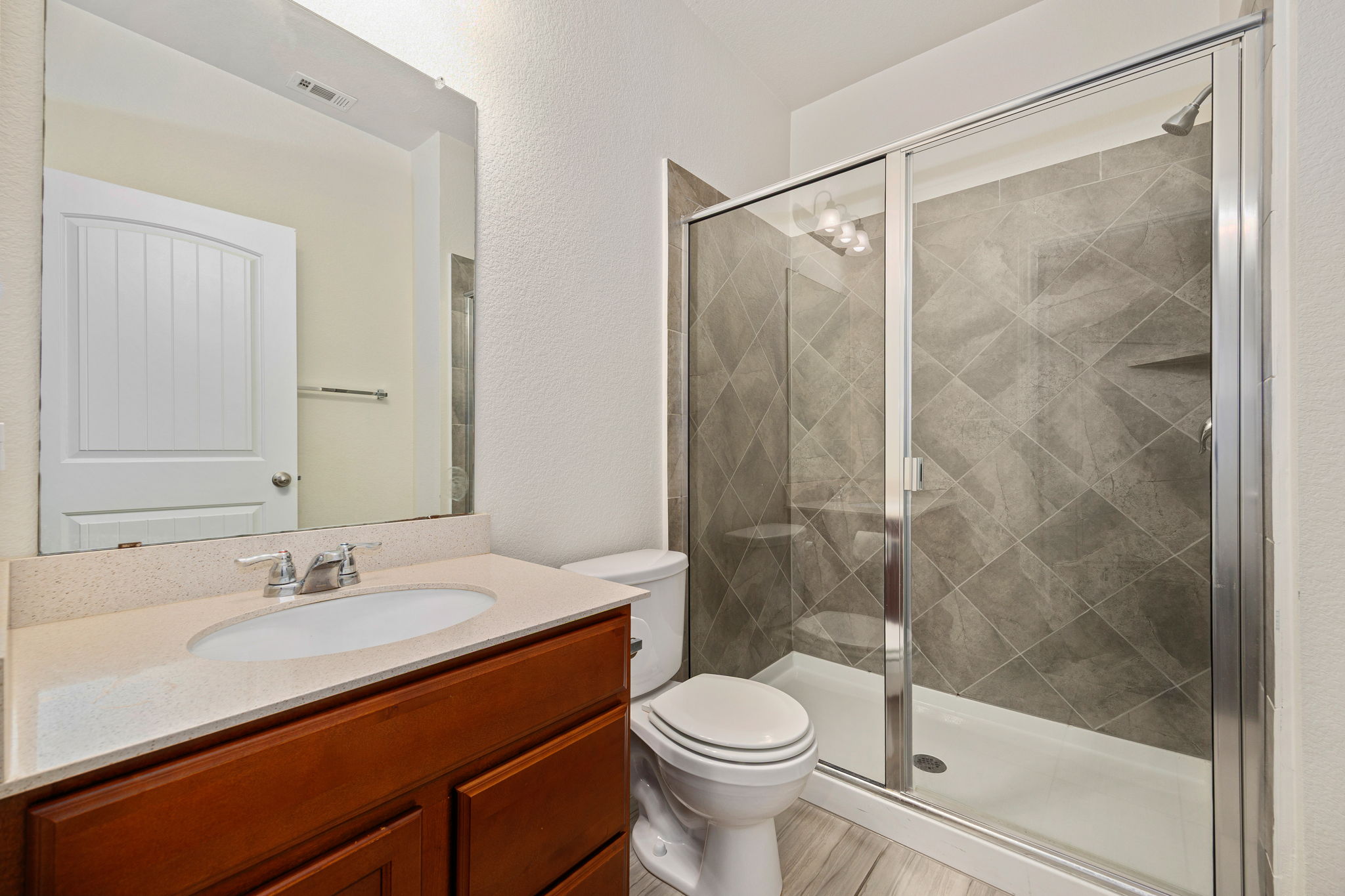 14615 Goshawk Drive Pflugerville, TX 78660 - Photo 12 of 29 a bathroom with a sink and a mirror