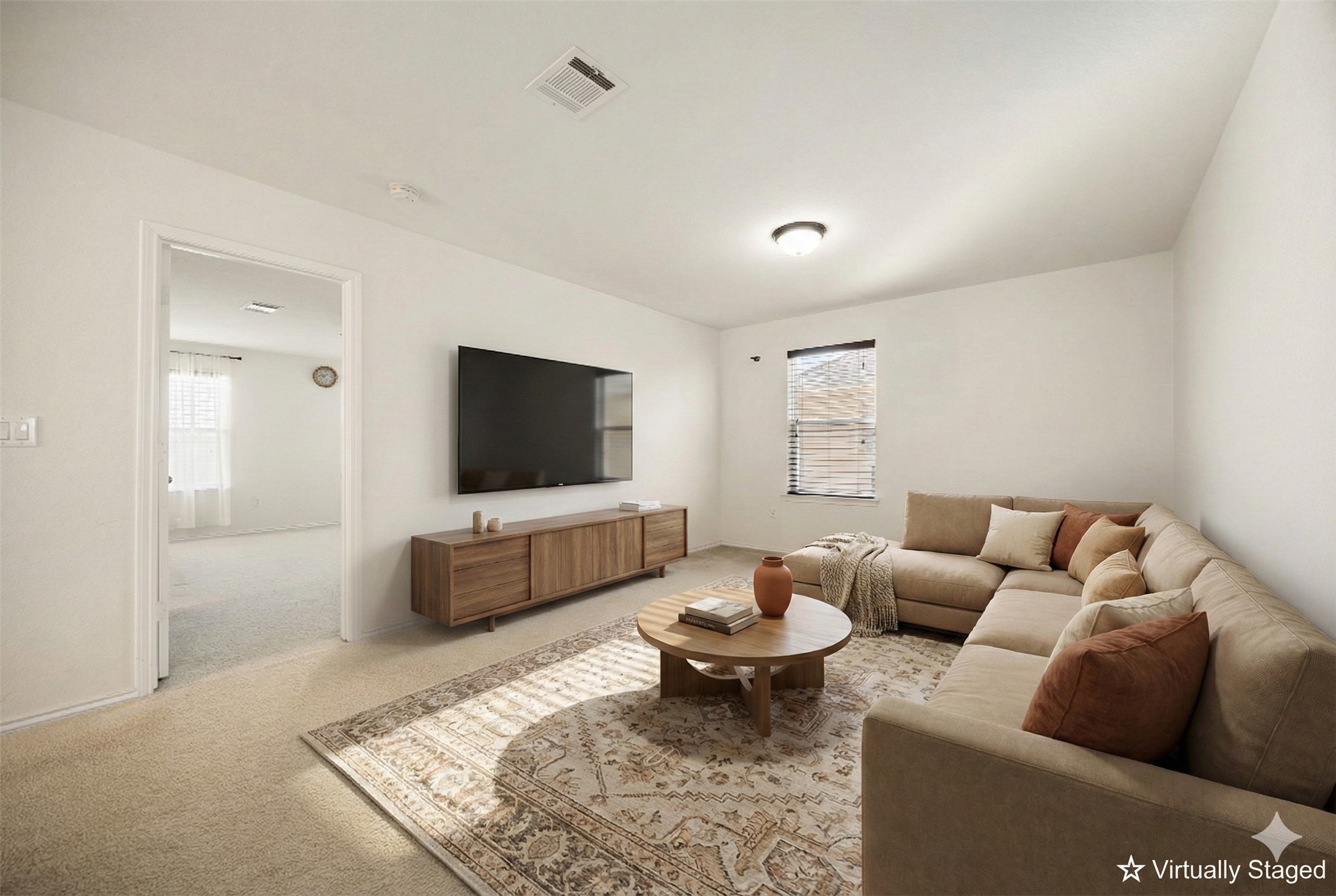 14615 Goshawk Drive Pflugerville, TX 78660 - Photo 14 of 29 a living room with furniture and a flat screen tv