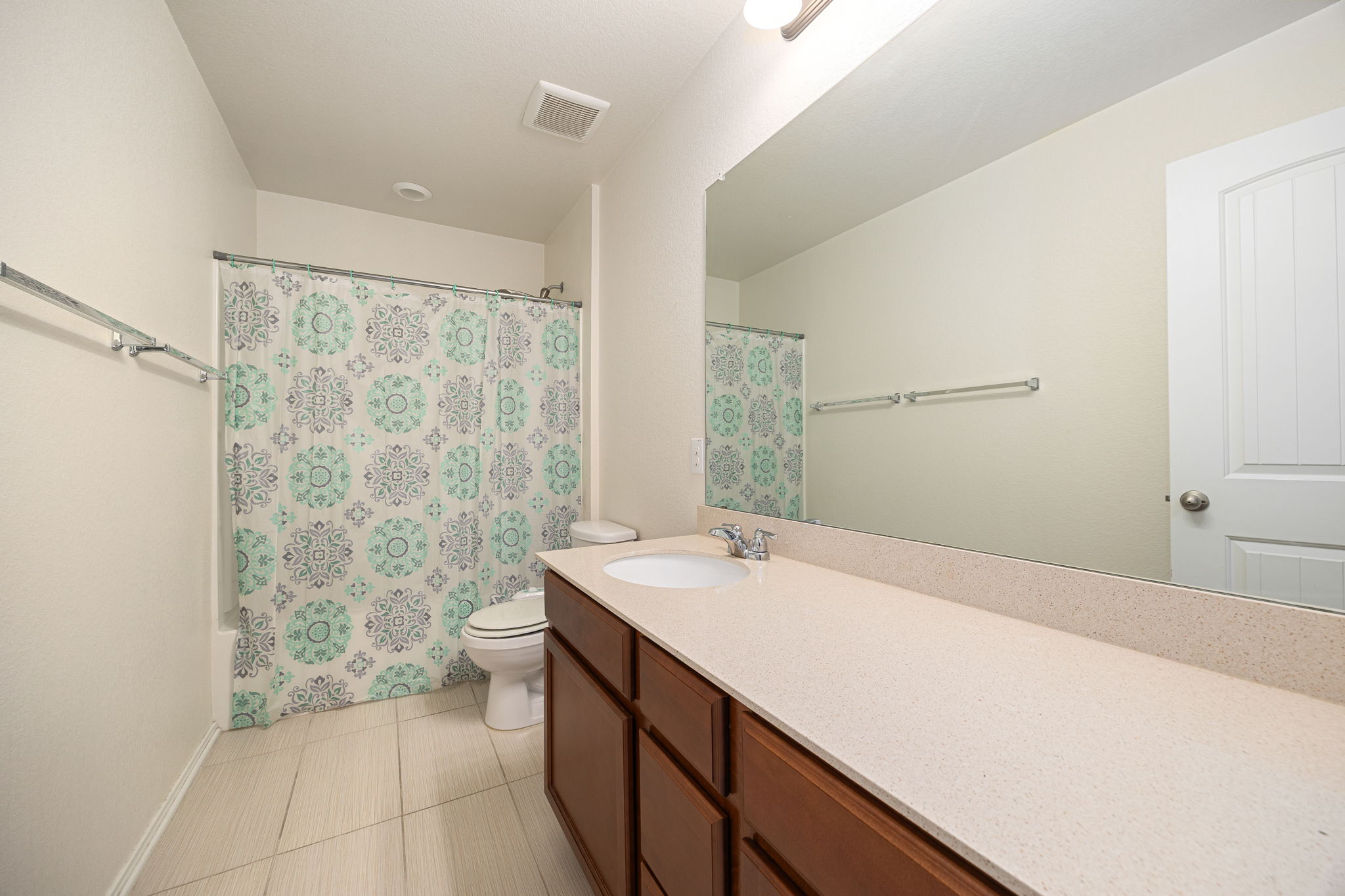 14615 Goshawk Drive Pflugerville, TX 78660 - Photo 22 of 29 a bathroom with a sink a toilet and shower