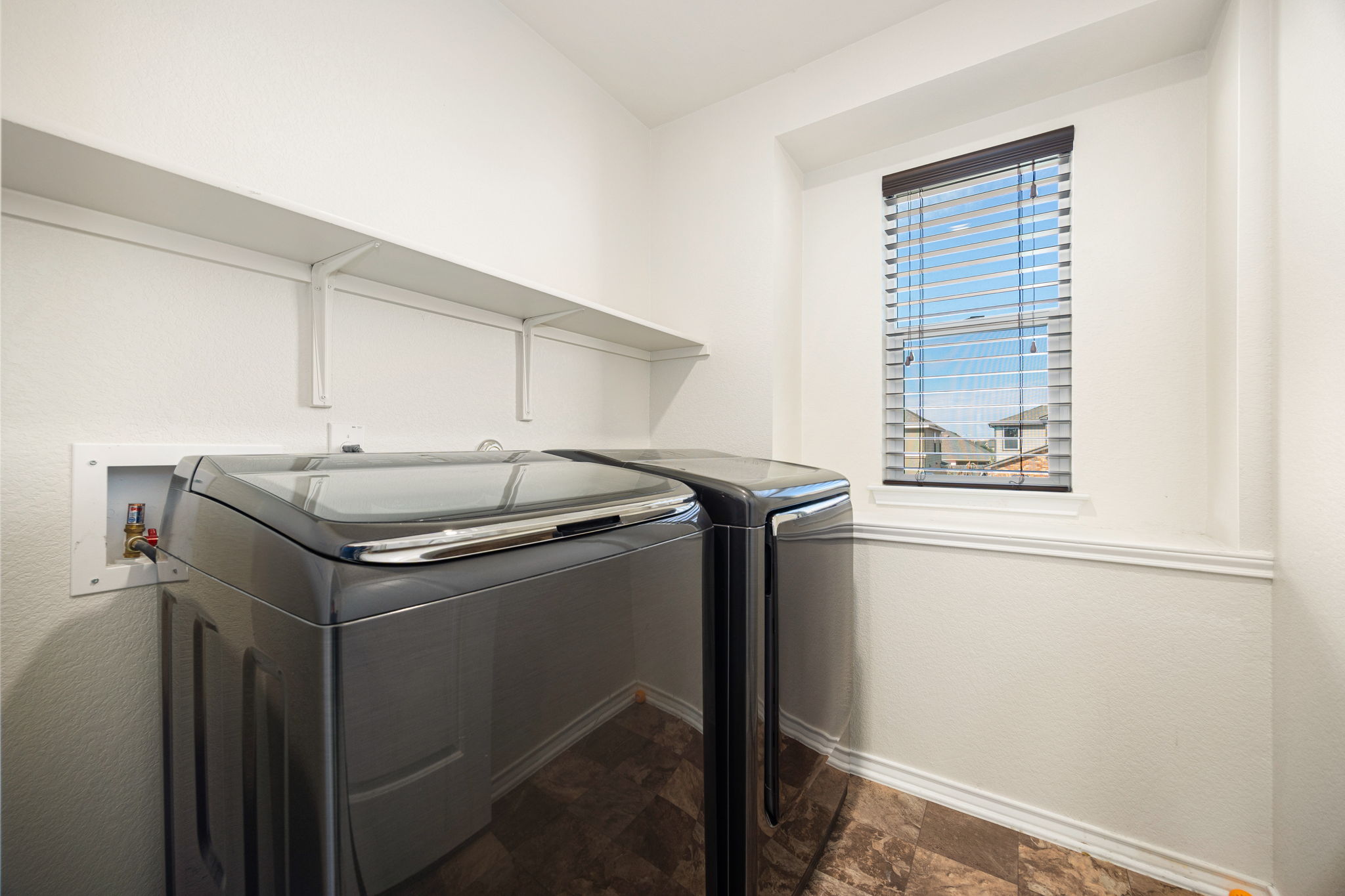 14615 Goshawk Drive Pflugerville, TX 78660 - Photo 24 of 29 a utility room with washer and dryer