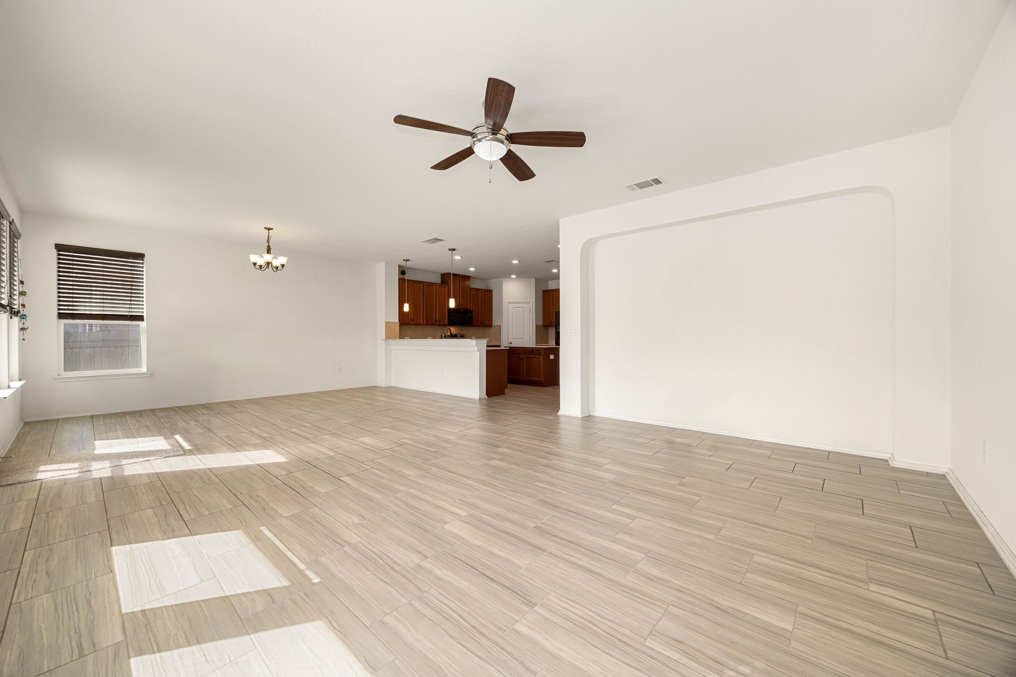 14615 Goshawk Drive Pflugerville, TX 78660 - Photo 3 of 29 a view of empty room with wooden floor