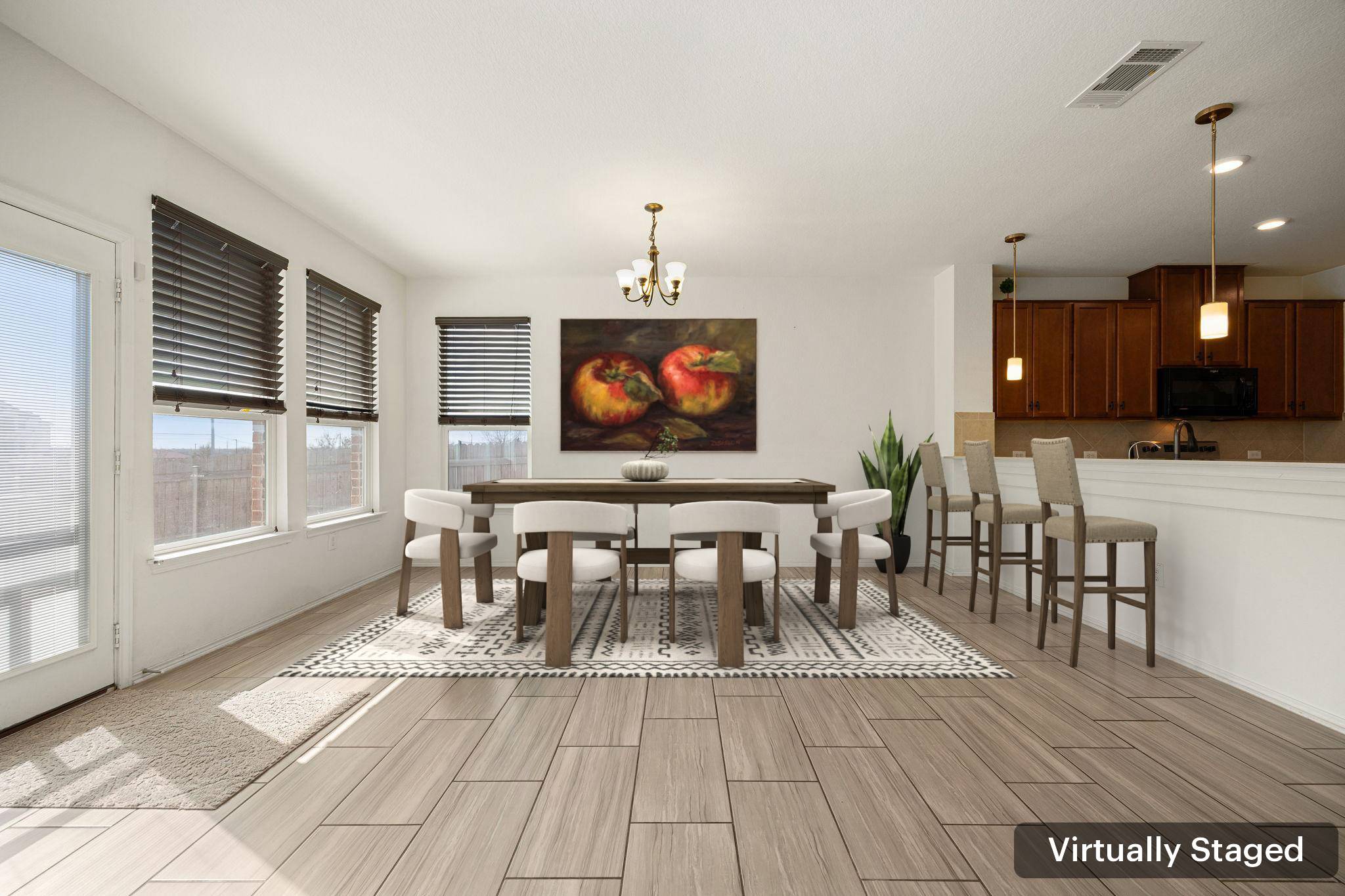 14615 Goshawk Drive Pflugerville, TX 78660 - Photo 5 of 29 a view of a dining room with furniture and wooden floor