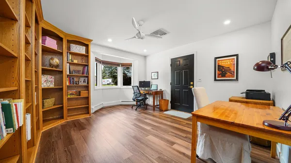 a bedroom with furniture and a window