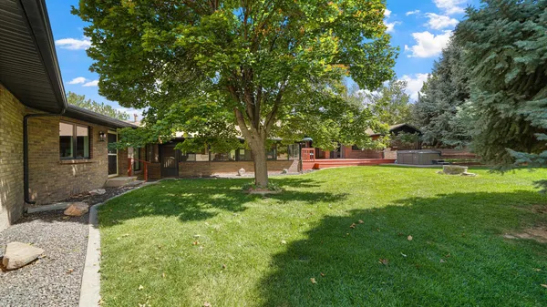 a view of a house with a backyard