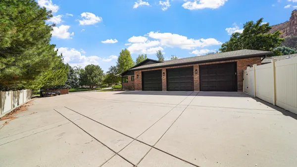 a view of house with backyard