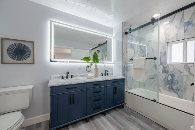 476 Spring Drive Toquerville, UT 84774 - Photo 74 of 95 Full bathroom featuring double vanity, light wood-type flooring, and enclosed tub / shower combo