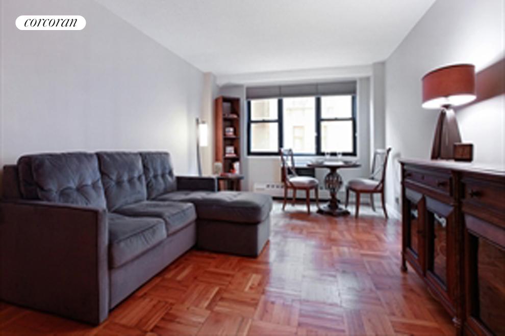 230 East 15th Street, Unit 3K Manhattan, NY 10003 - Photo 1 of 5 a living room with furniture and a large window
