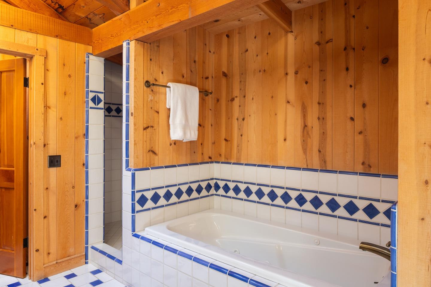 17094 Cachagua Road Carmel Valley, CA 93924 - Photo 17 of 42 a bathroom with a tub and shower
