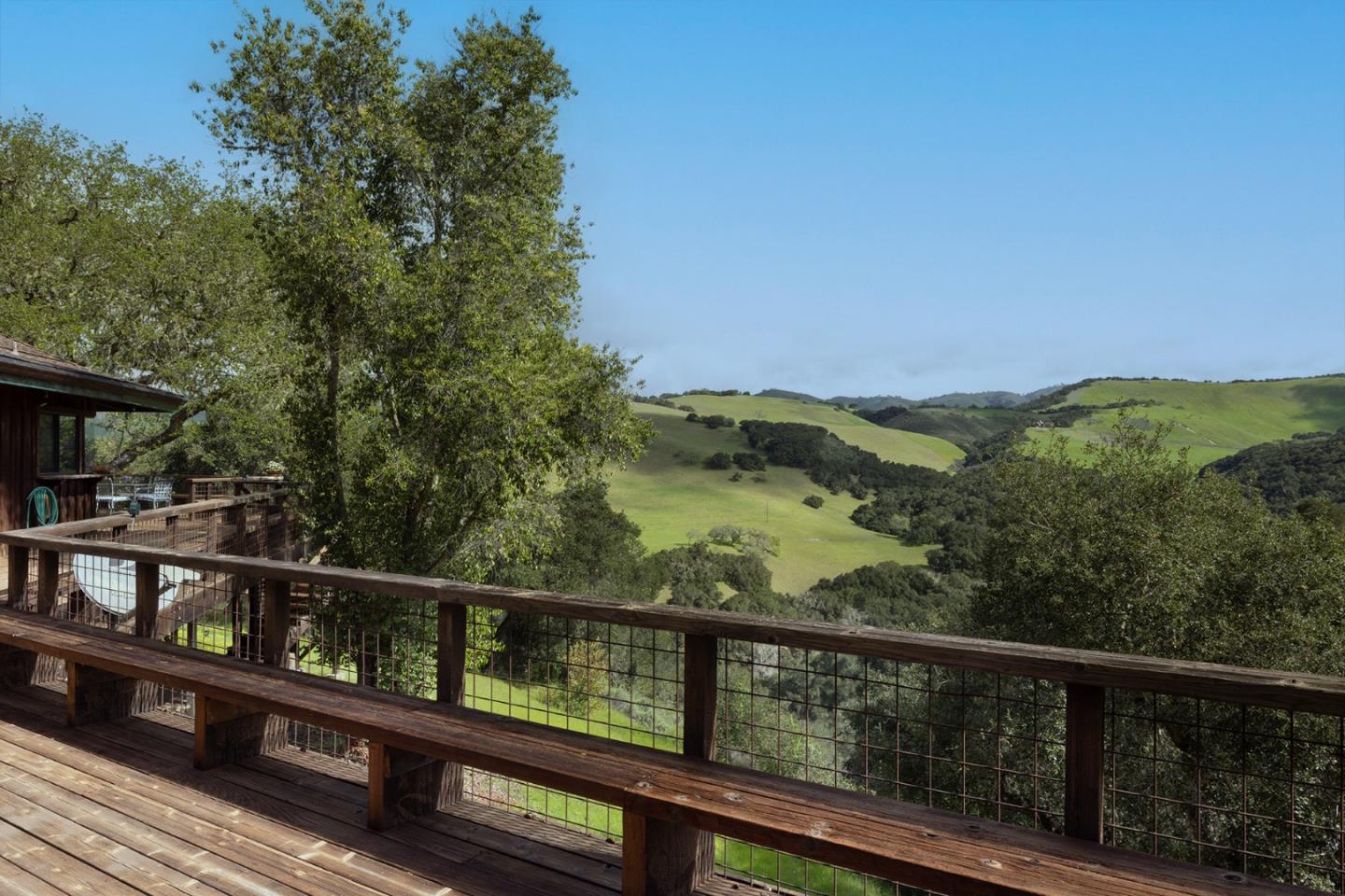 17094 Cachagua Road Carmel Valley, CA 93924 - Photo 23 of 42 a view of a balcony with wooden floor and fence