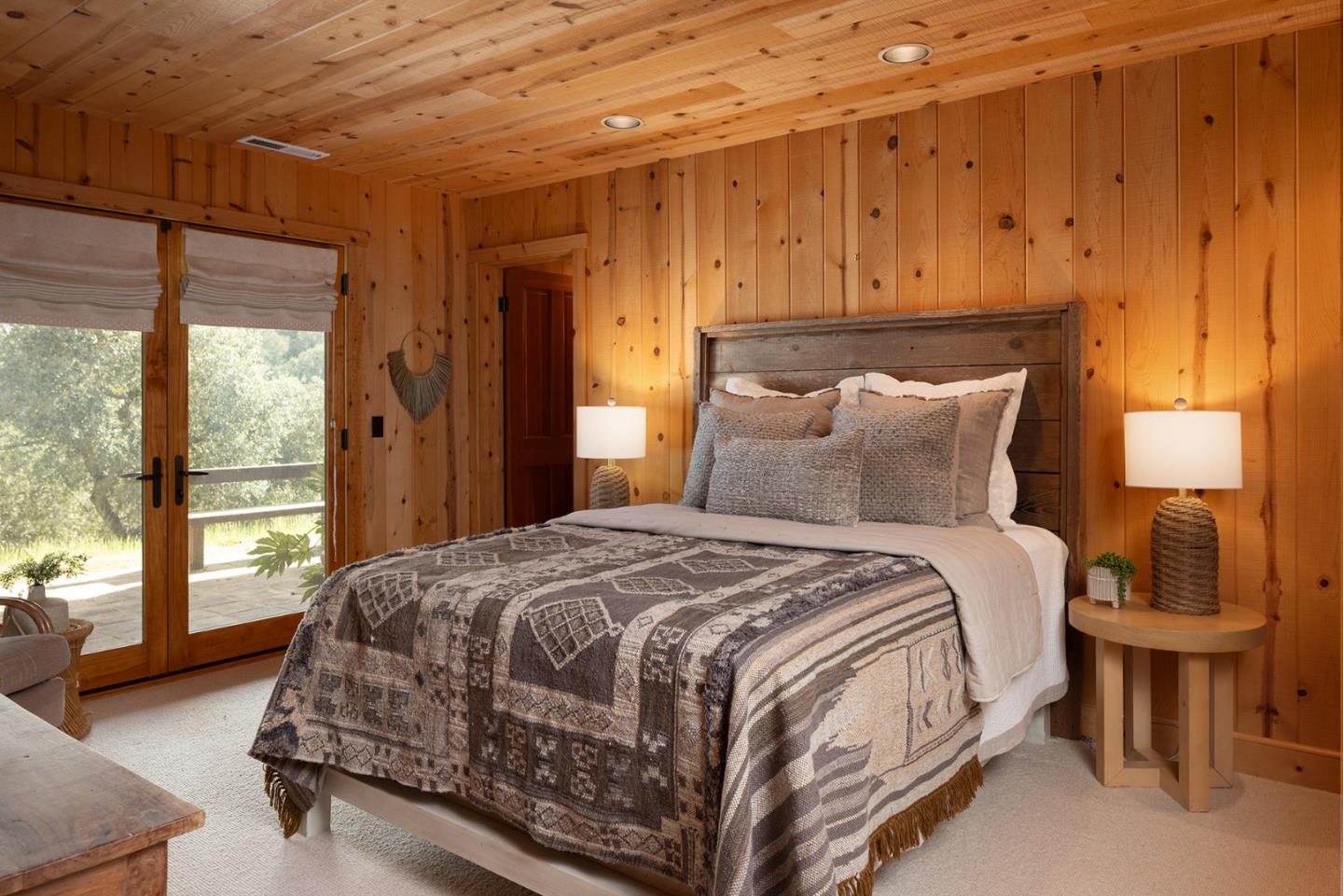 17094 Cachagua Road Carmel Valley, CA 93924 - Photo 27 of 42 a bedroom with a bed and wooden floor