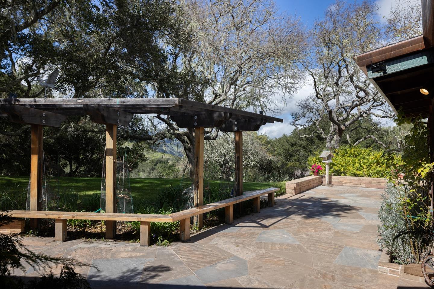 17094 Cachagua Road Carmel Valley, CA 93924 - Photo 3 of 42 a view of a roof deck with wooden fence and a couple of chairs