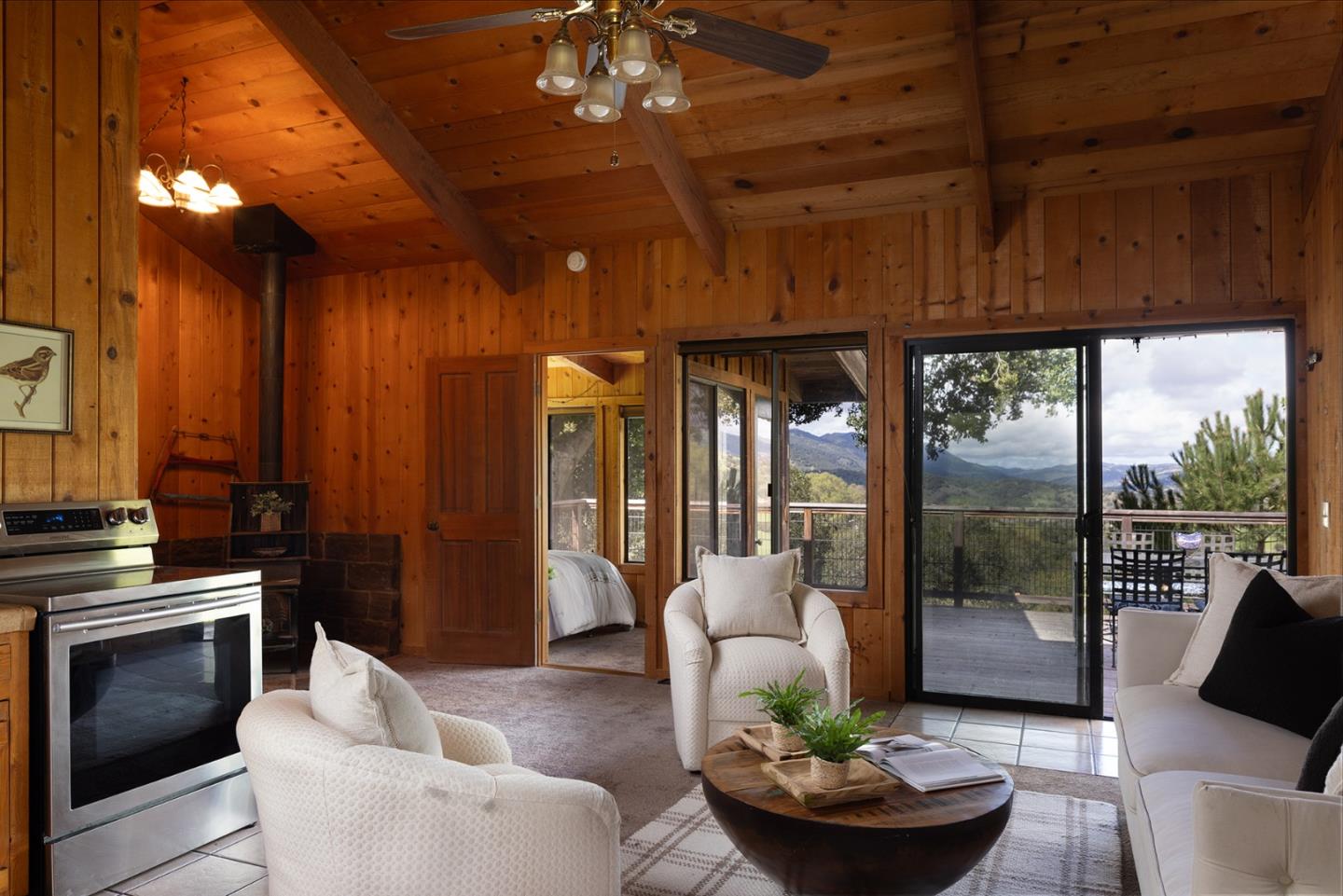 17094 Cachagua Road Carmel Valley, CA 93924 - Photo 37 of 42 a living room with furniture and a fireplace