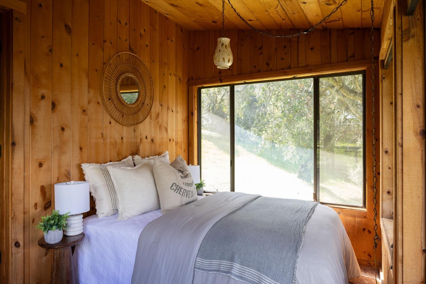 17094 Cachagua Road Carmel Valley, CA 93924 - Photo 39 of 42 a bedroom with a bed and a window