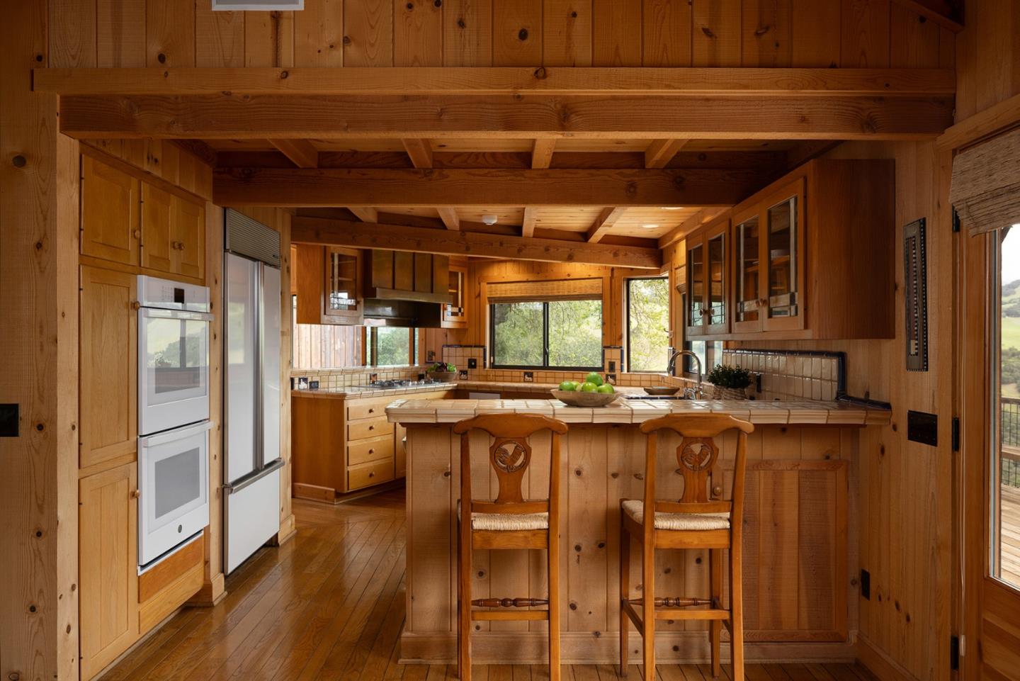 17094 Cachagua Road Carmel Valley, CA 93924 - Photo 7 of 42 a kitchen with a table and chairs in it