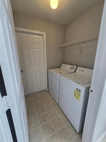 a view of an house with backyard space and balcony