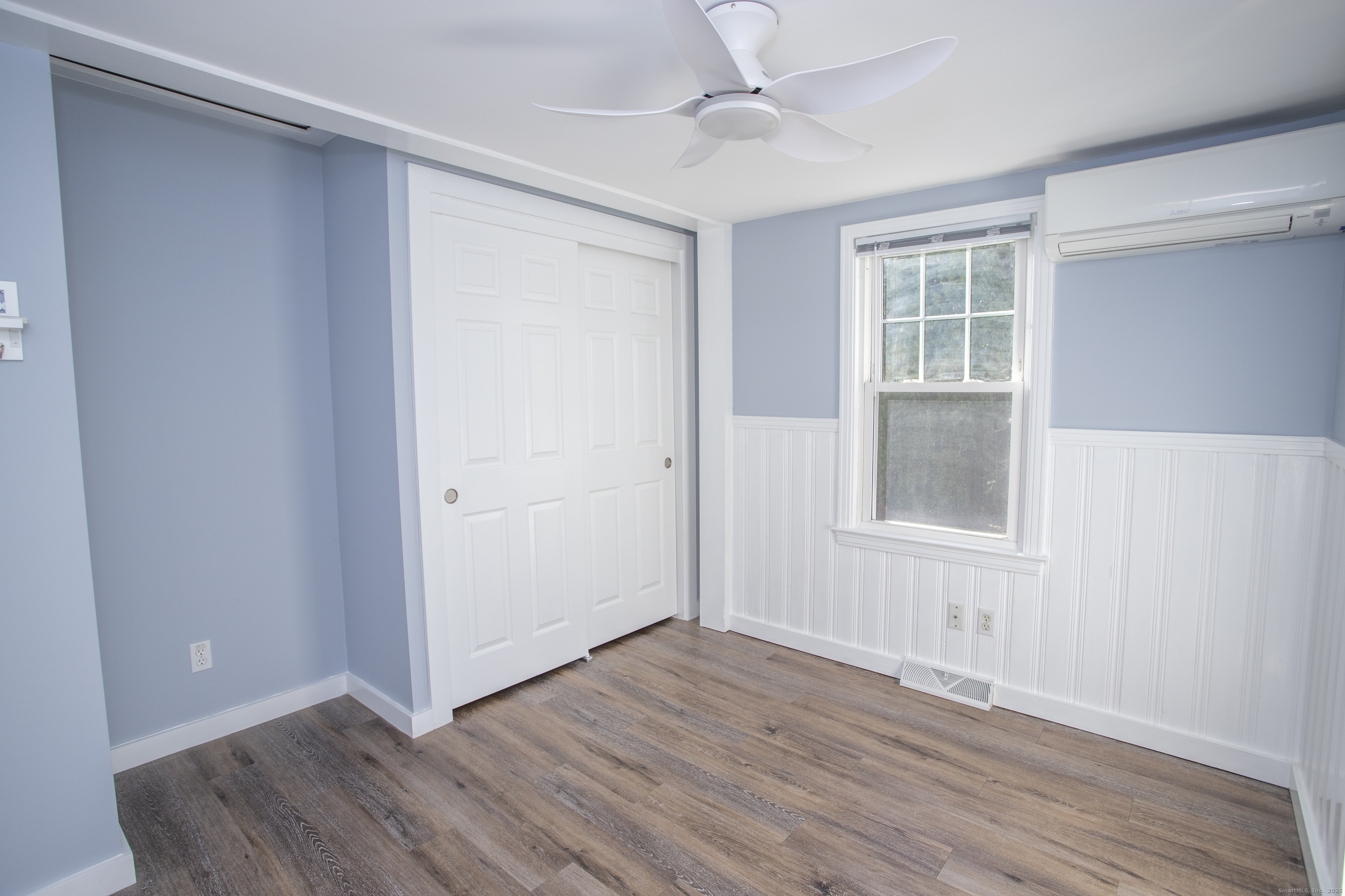 10 Dorothy Road Westbrook, CT 06498 - Photo 18 of 25 a view of an empty room with wooden floor and a window