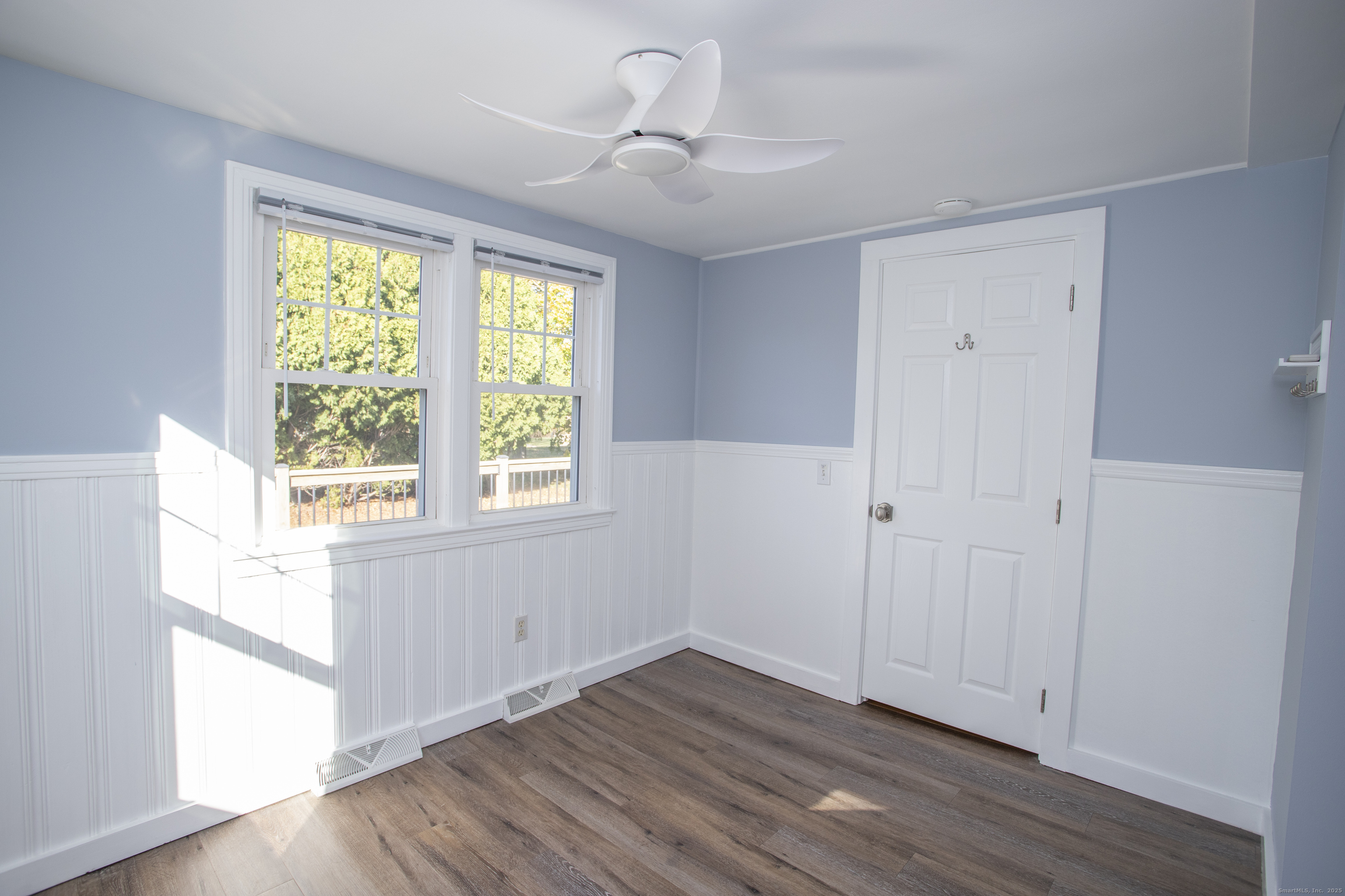10 Dorothy Road Westbrook, CT 06498 - Photo 19 of 25 a view of an empty room with wooden floor and a window