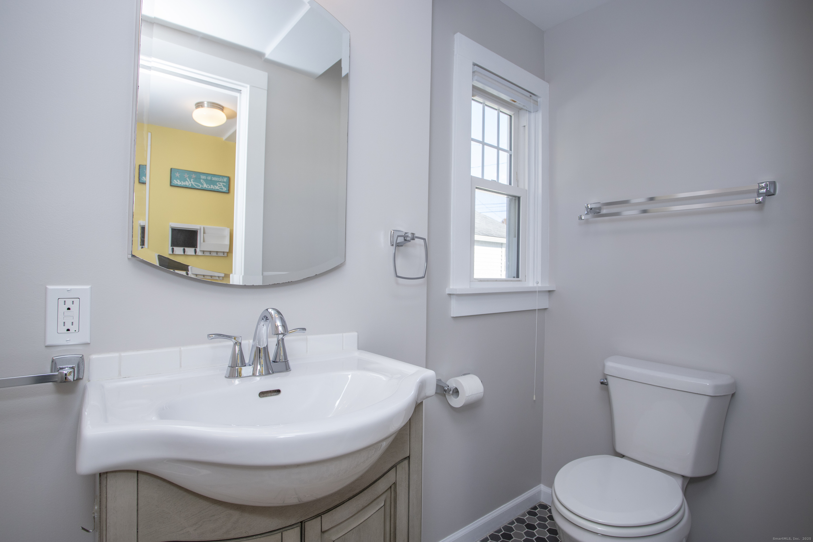 10 Dorothy Road Westbrook, CT 06498 - Photo 20 of 25 a bathroom with a sink toilet and mirror