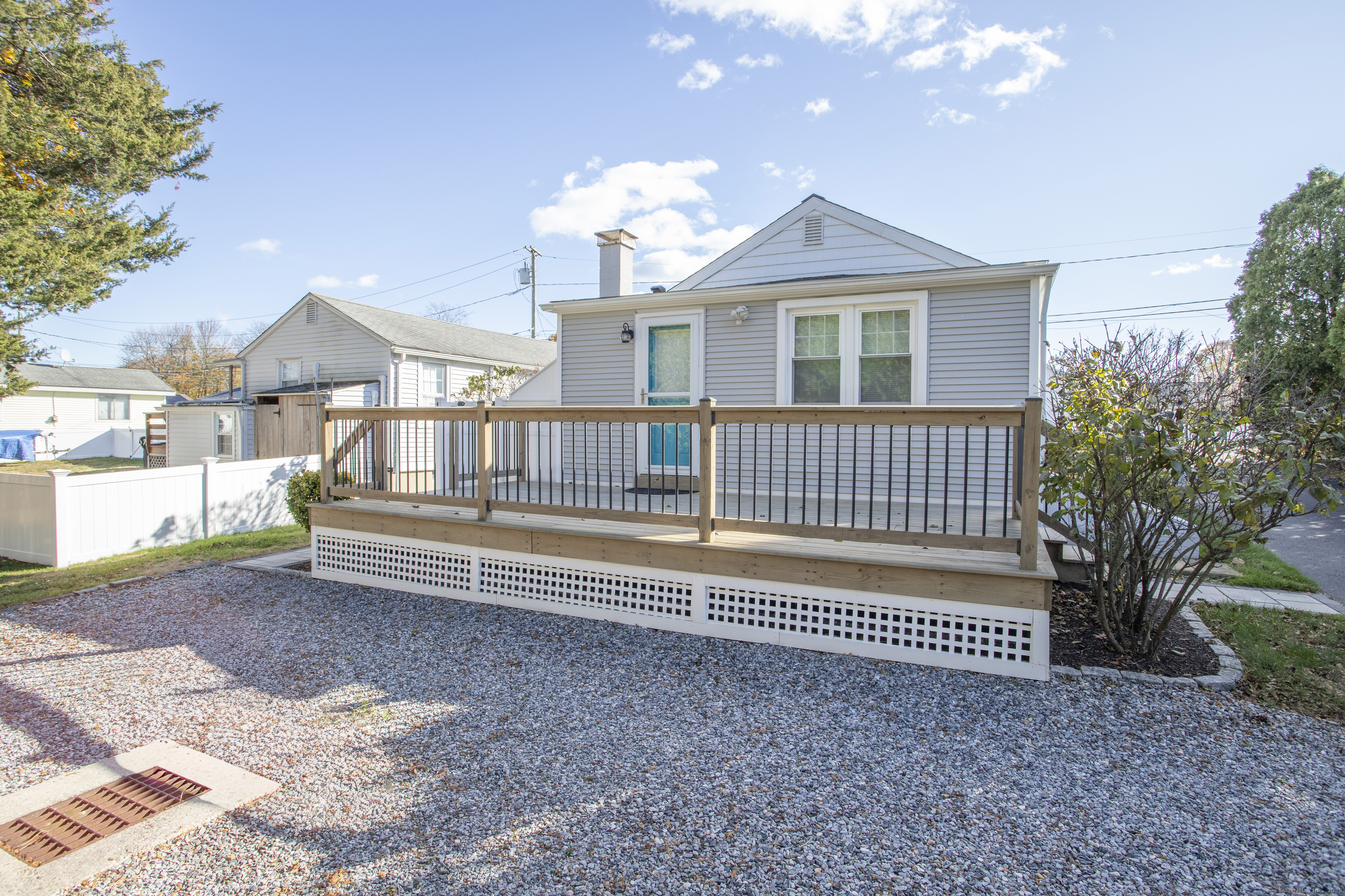 10 Dorothy Road Westbrook, CT 06498 - Photo 5 of 25 a view of a house with a deck and a yard