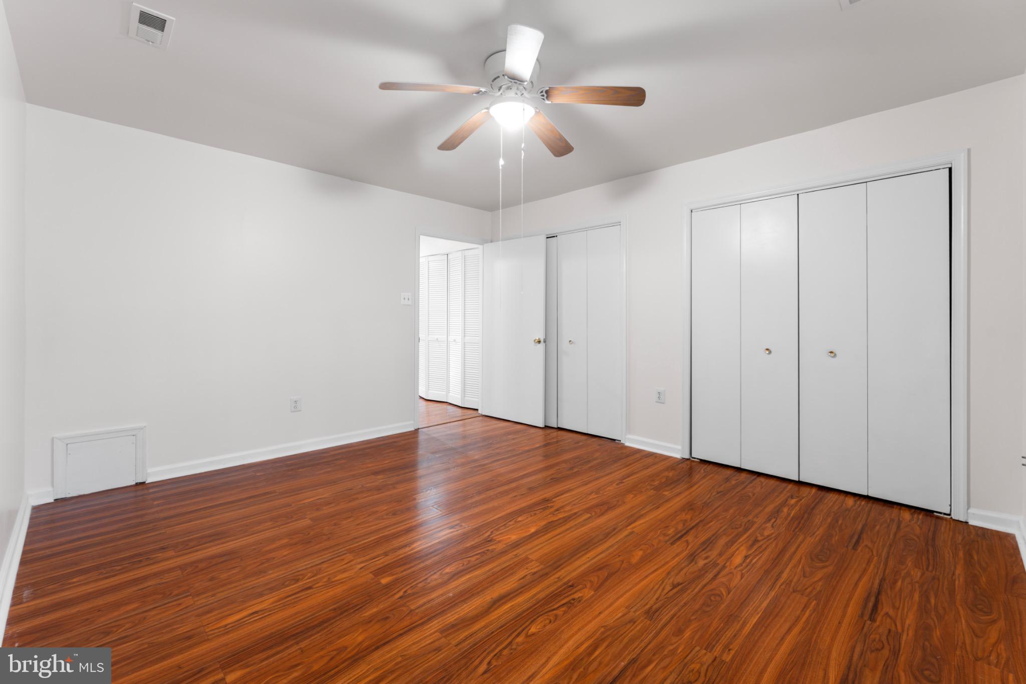 9266 Cherry Lane, Unit 51 Laurel, MD 20708 - Photo 15 of 23 Spacious room with warm wood flooring.