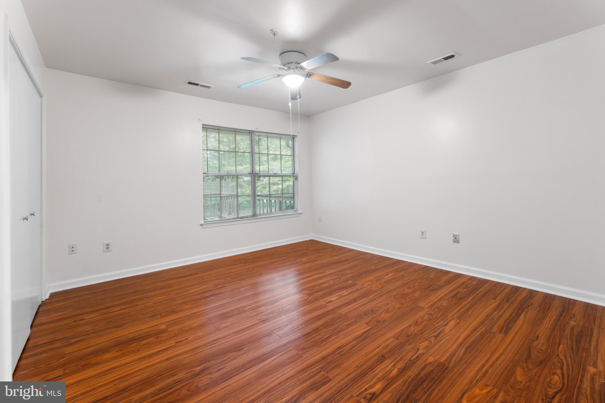 9266 Cherry Lane, Unit 51 Laurel, MD 20708 - Photo 16 of 23 Bright and airy space with warm wood floors.