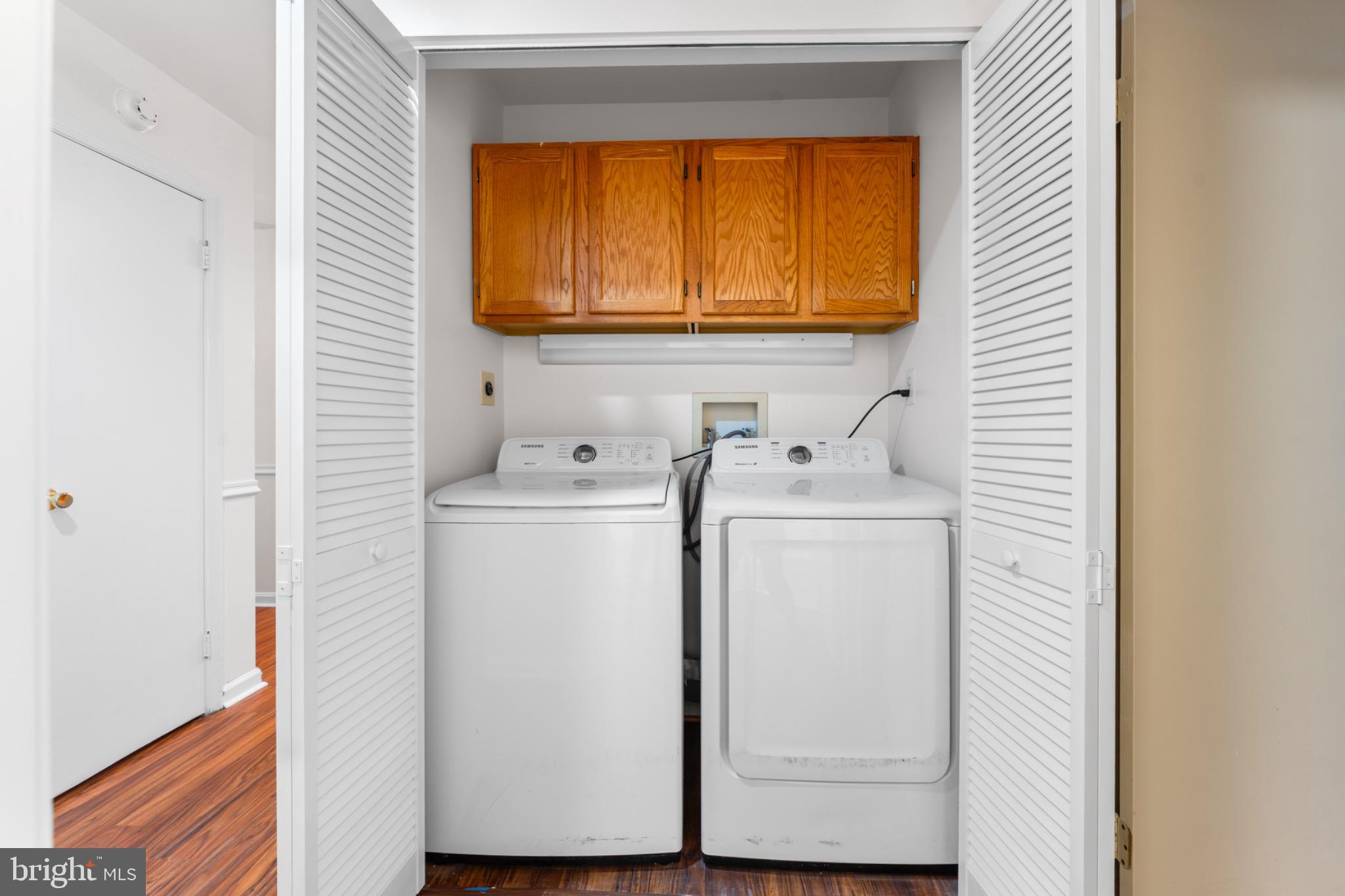 9266 Cherry Lane, Unit 51 Laurel, MD 20708 - Photo 21 of 23 Efficient laundry space with ample storage.