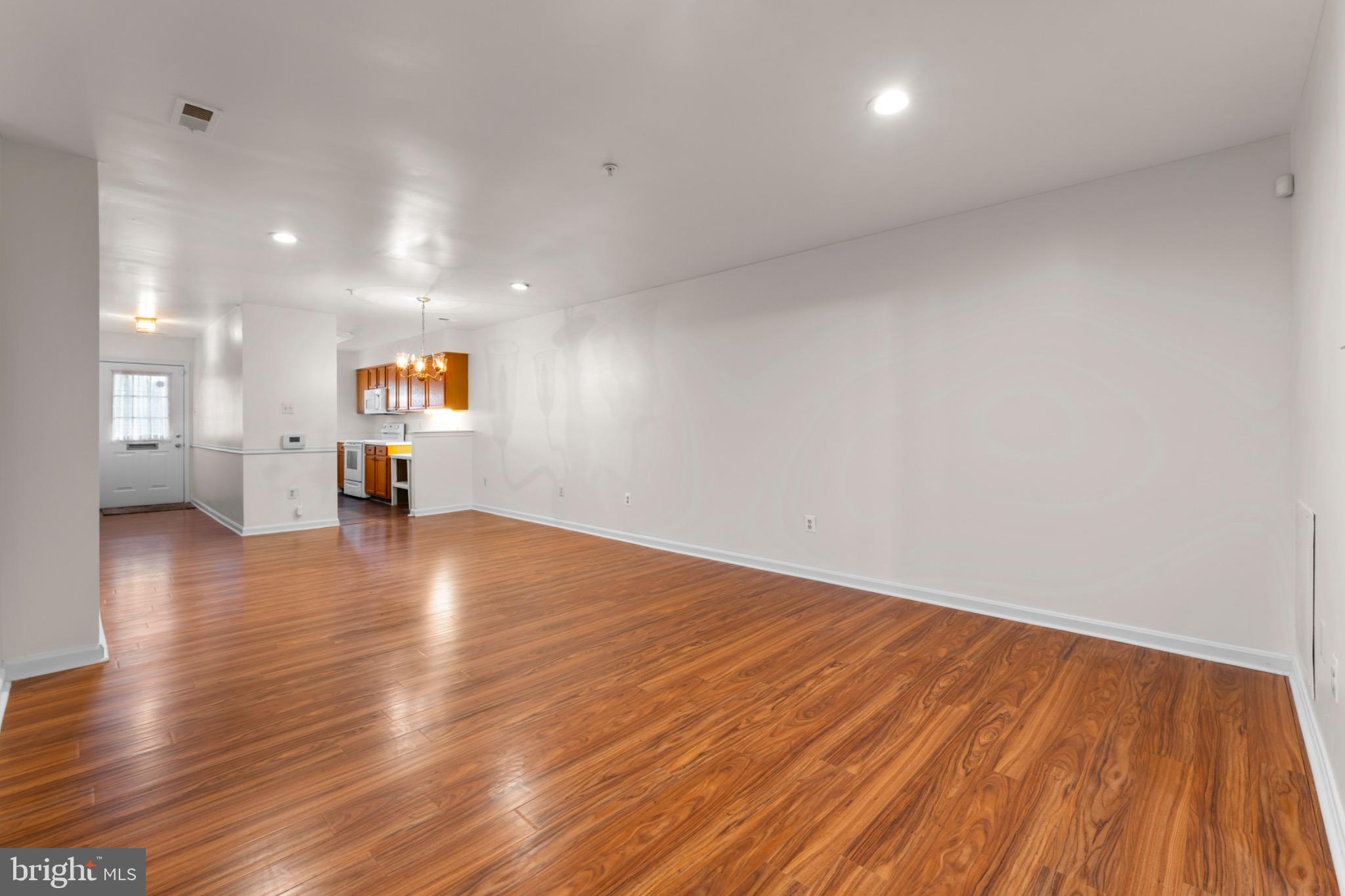 9266 Cherry Lane, Unit 51 Laurel, MD 20708 - Photo 5 of 23 Spacious, modern living area with warm tones.