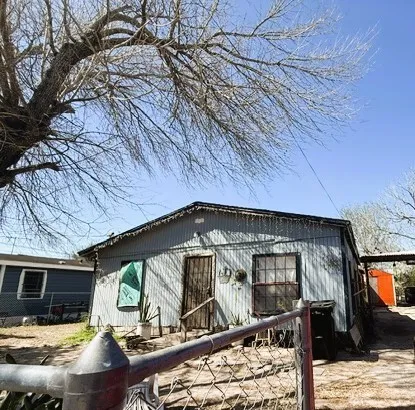a view of a car park in front of house