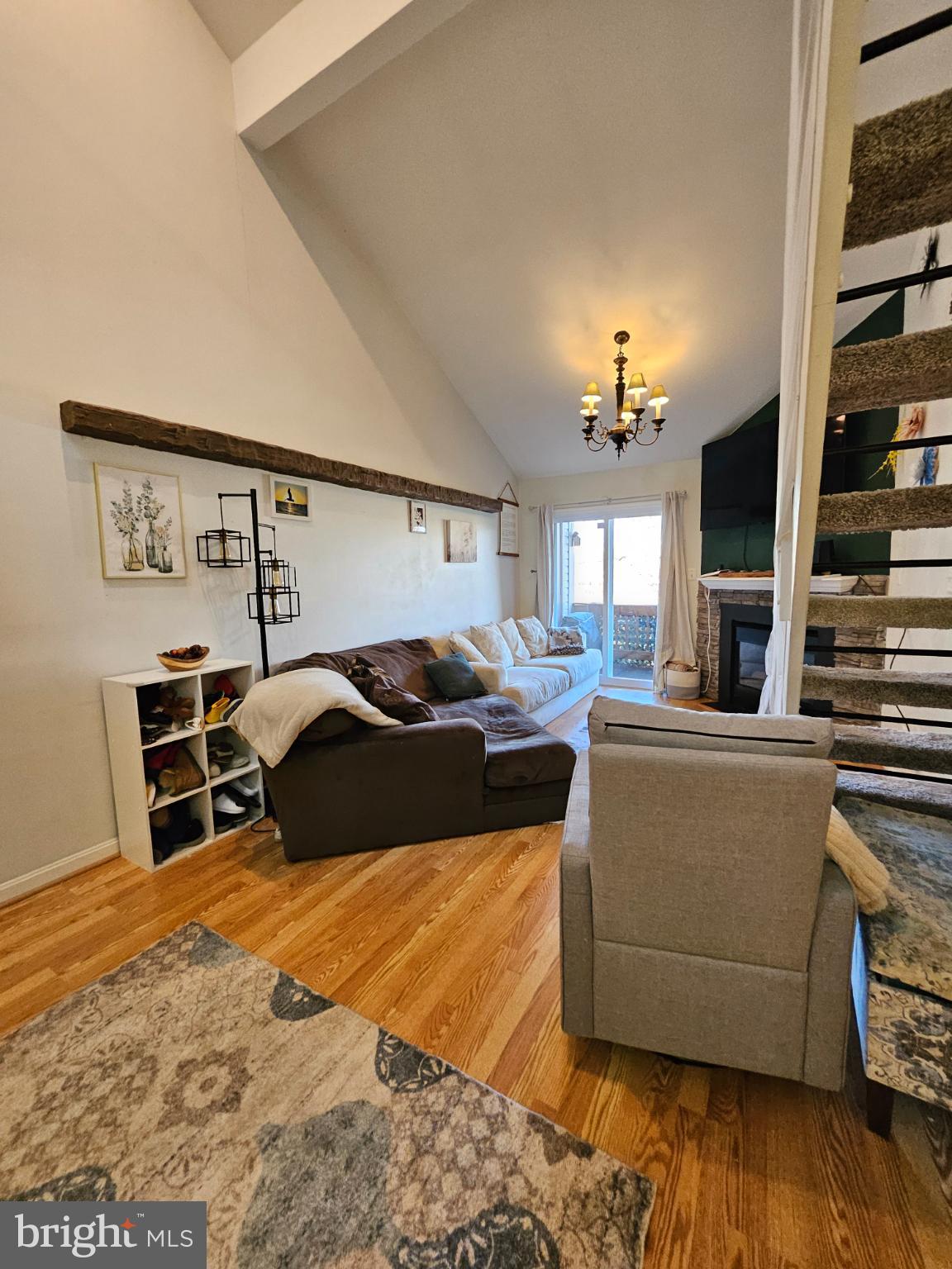 9200 Azure Court, Unit 201 Manassas, VA 20110 - Photo 11 of 20 a bedroom with a bed and wooden floor