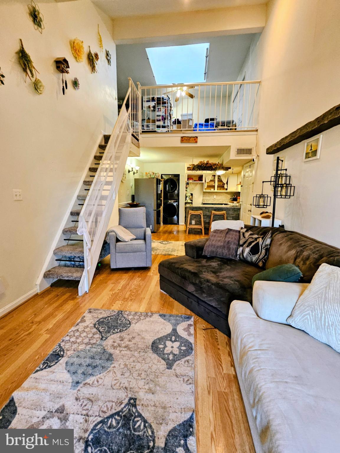 9200 Azure Court, Unit 201 Manassas, VA 20110 - Photo 12 of 20 a living room with furniture and wooden floor