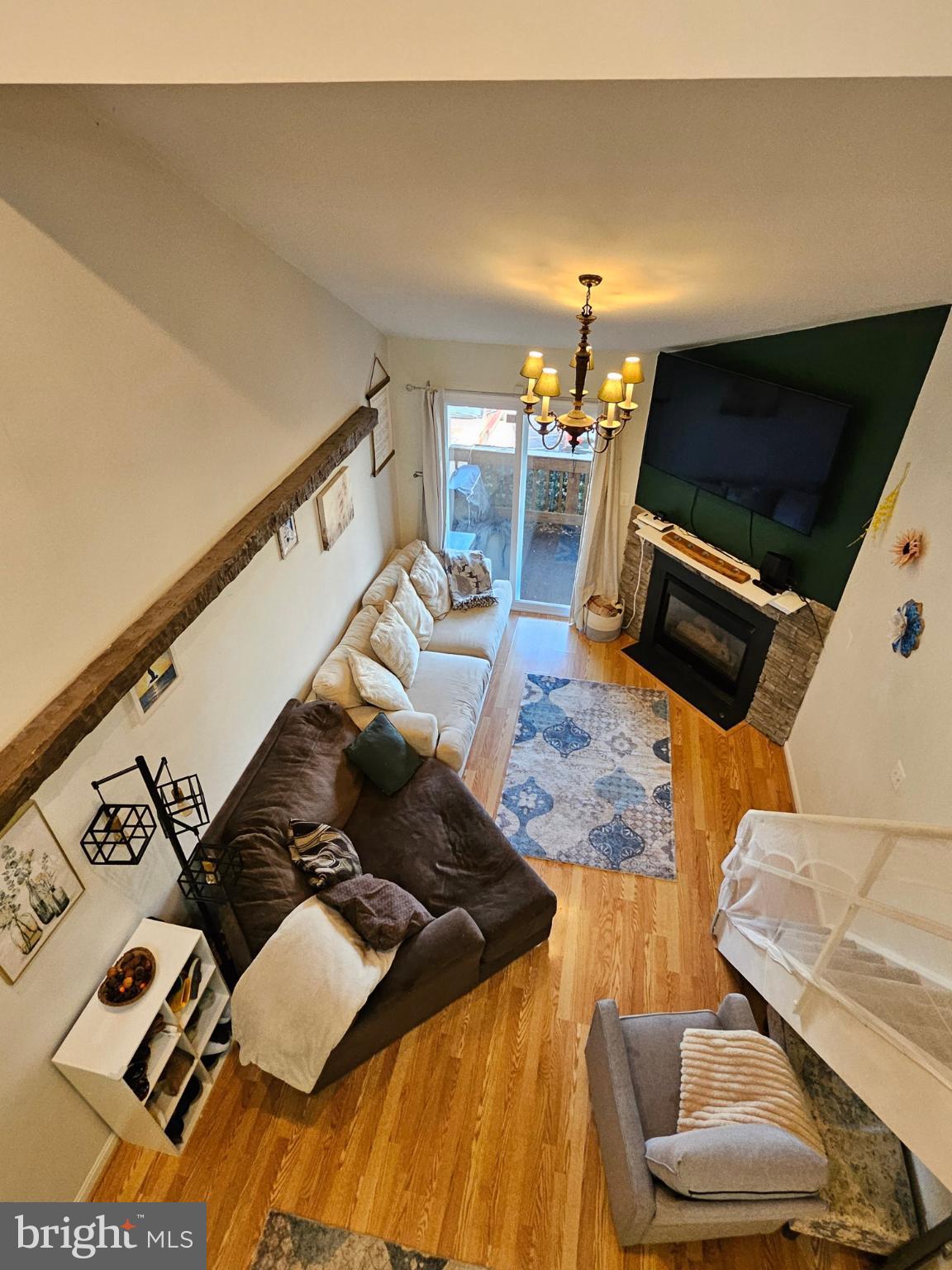 9200 Azure Court, Unit 201 Manassas, VA 20110 - Photo 14 of 20 a living room with furniture and a flat screen tv