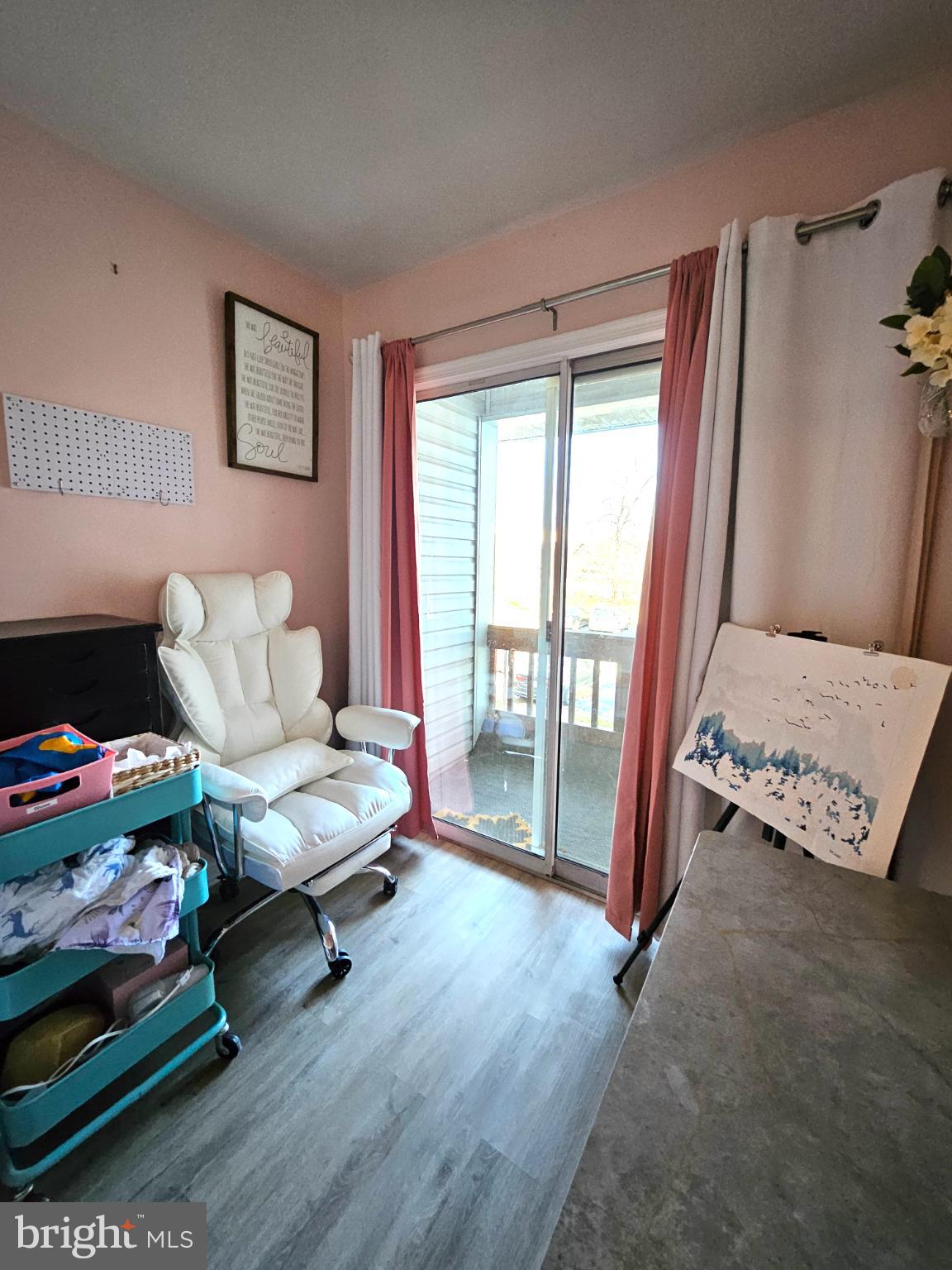9200 Azure Court, Unit 201 Manassas, VA 20110 - Photo 18 of 20 a living room with furniture and a floor to ceiling window