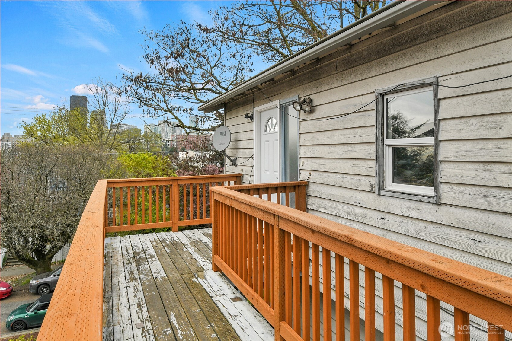 338 16th Avenue, Unit B Seattle, WA 98122 - Photo 2 of 7 a view of balcony with wooden floor and fence