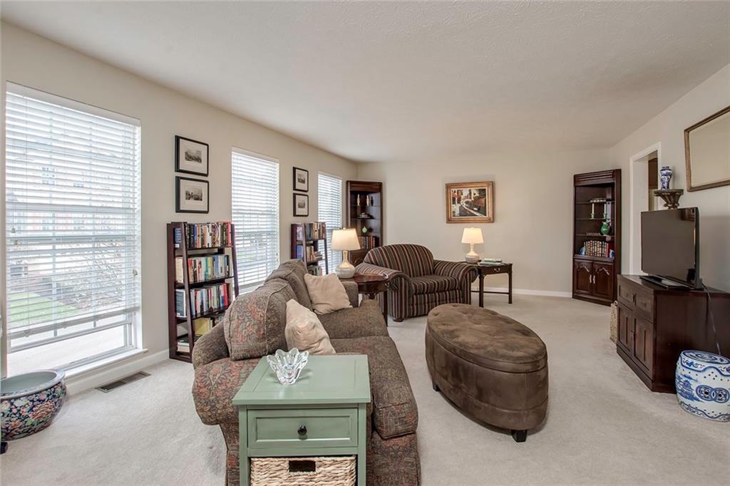 With all of the Windows, The Living Room is Flooded with Natural Light!