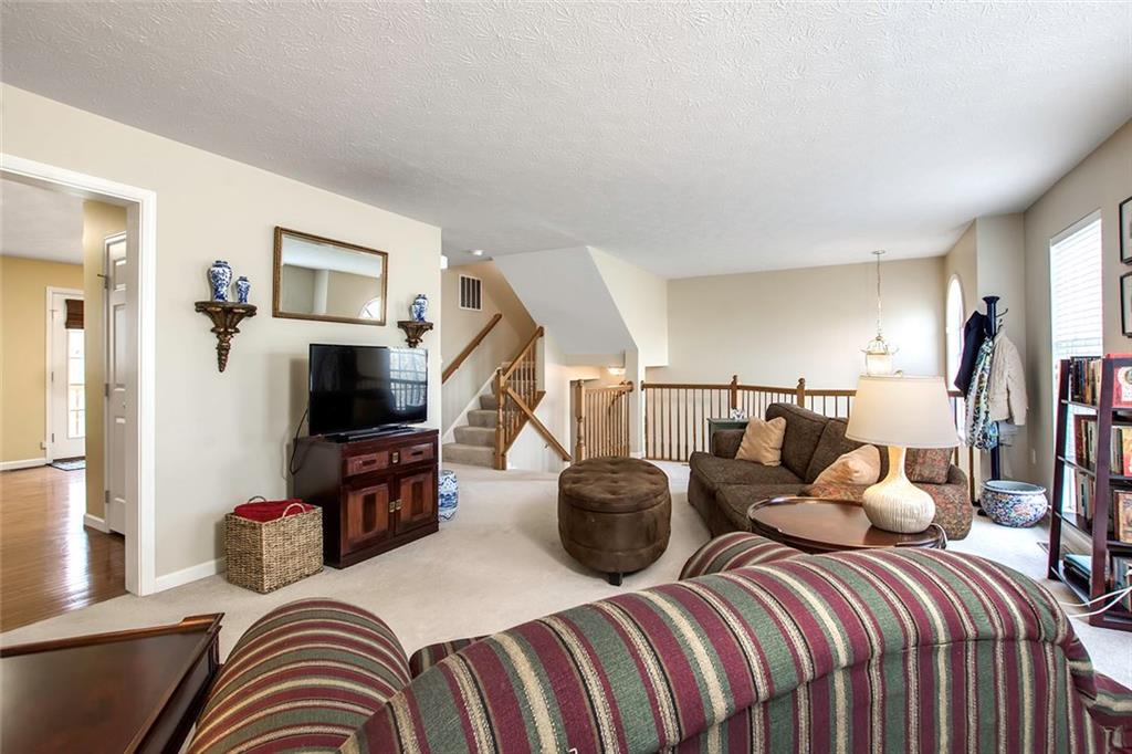 Looking From the Living Room Into the Kitchen and Back Towards the Foyer