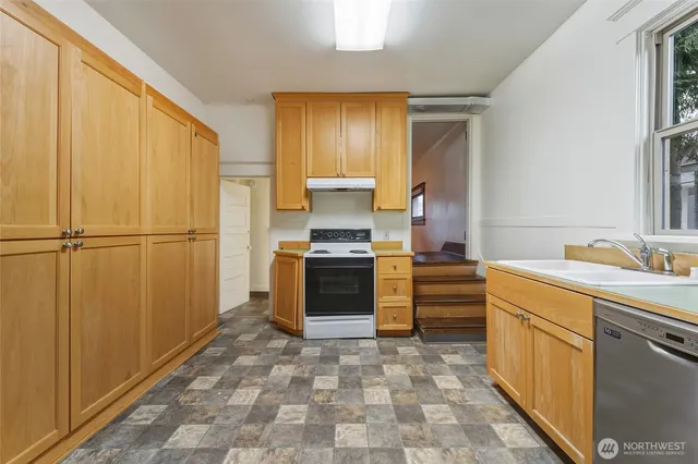 a view of an empty room and closet area