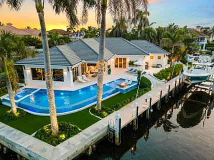 a view of house with swimming pool outdoor seating